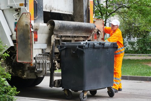 Workers sorting recyclable materials during a Ruislip flat clearance